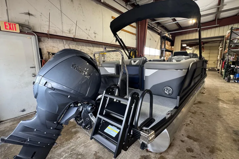 Slide: The Image of 2026 Evotti 521QL pontoon boat with Yamaha outboard motor in a warehouse setting. - 10