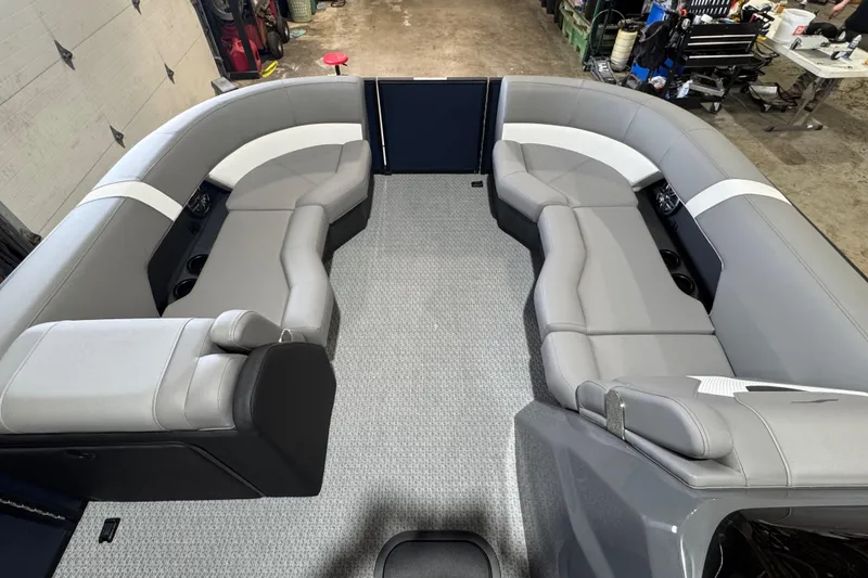 Slide: The Image of Luxurious interior of 2026 Evotti 521QL boat with gray seating and carpeted floor. - 4