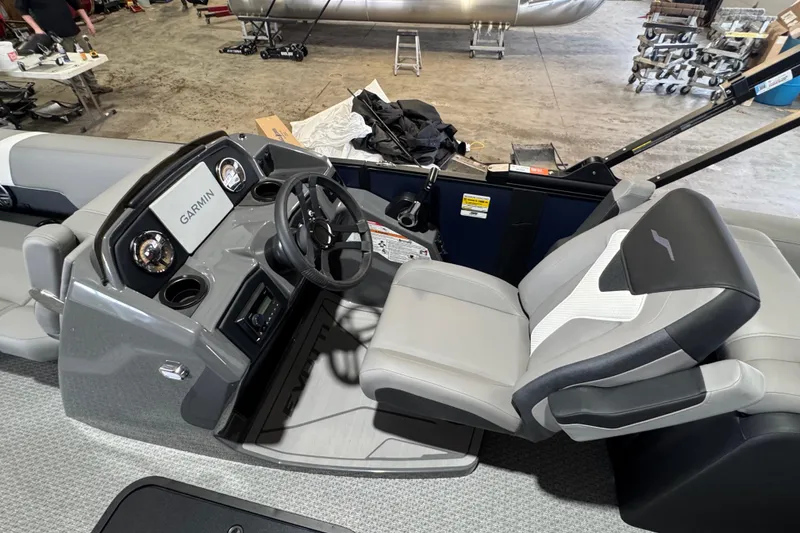 Slide: The Image of Interior of 2026 Evotti 521QL boat with Garmin navigation system and modern seating. - 5