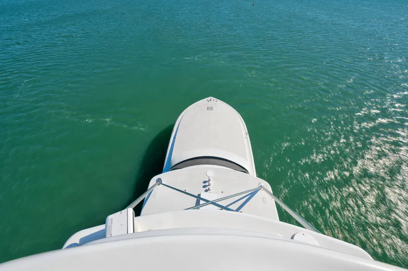 Slide: The Image of Aerial view of 2002 Viking Convertible yacht on turquoise water. - 11