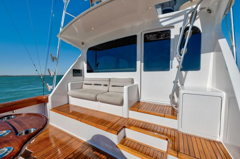 Slide: The Image of Luxury 2002 Viking Convertible yacht deck with seating and ocean view. - 14