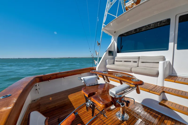 Slide: The Image of 2002 Viking Convertible yacht deck with seating, fishing chair, and ocean view. - 16