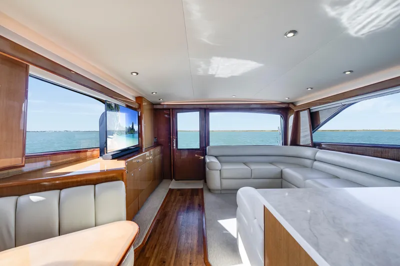 Slide: The Image of Luxurious interior of a 2002 Viking Convertible yacht with elegant seating and ocean views. - 22