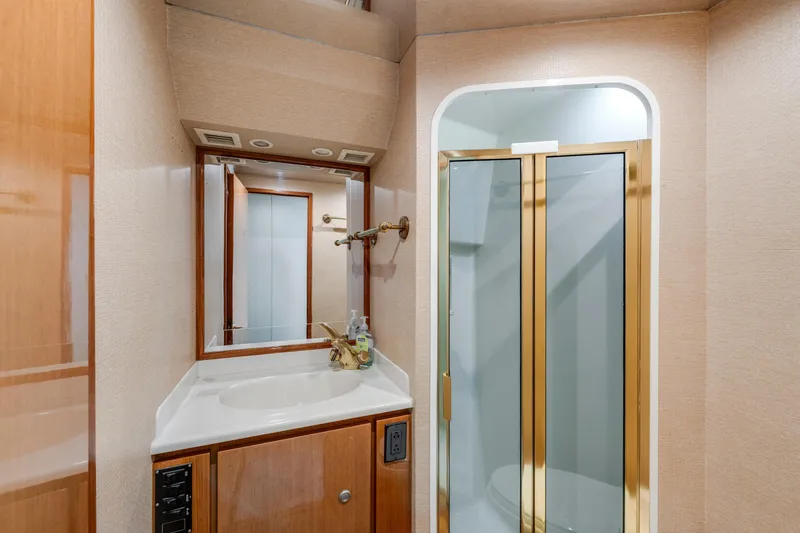 Slide: The Image of Luxurious bathroom in 2002 Viking Convertible yacht with shower and vanity. - 31