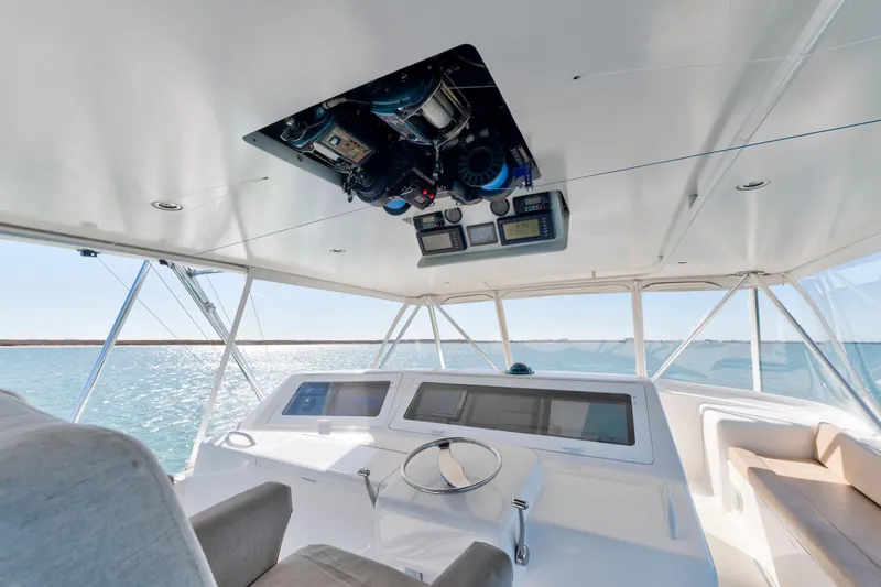 Slide: The Image of 2002 Viking Convertible yacht helm with ocean view and navigation equipment. - 4