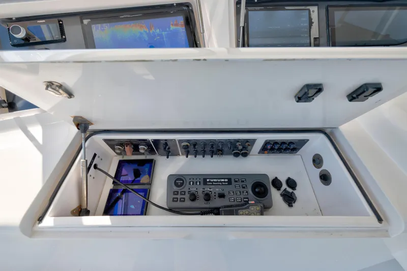 Slide: The Image of Control panel of a 2002 Viking Convertible boat with navigation and communication equipment. - 7