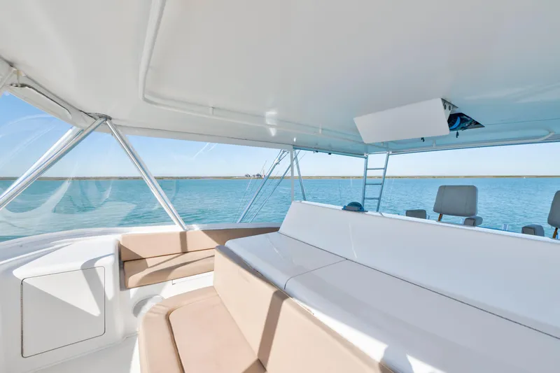 Slide: The Image of Interior view of 2002 Viking Convertible yacht with ocean backdrop. - 9