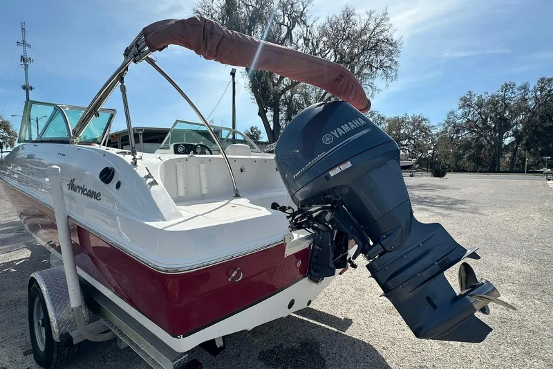 Slide: The Image of 2016 Hurricane SunDeck 187 OB boat with Yamaha outboard motor on trailer. - 17