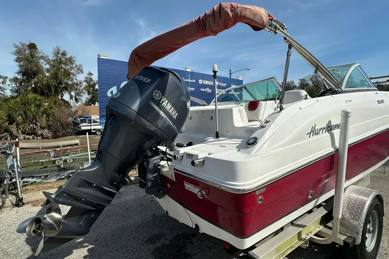 Slide: The Image of 2016 Hurricane SunDeck 187 OB boat with Yamaha outboard motor on trailer. - 18