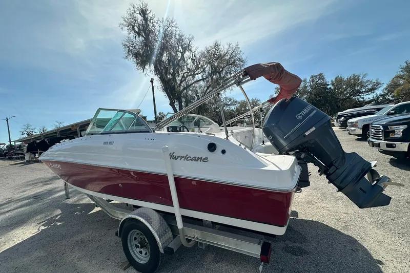 Slide: The Image of 2016 Hurricane SunDeck 187 OB boat on trailer with Yamaha outboard motor. - 3