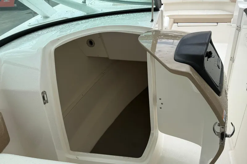 Slide: The Image of 2024 Robalo R317 Dual Console boat interior storage compartment. - 13