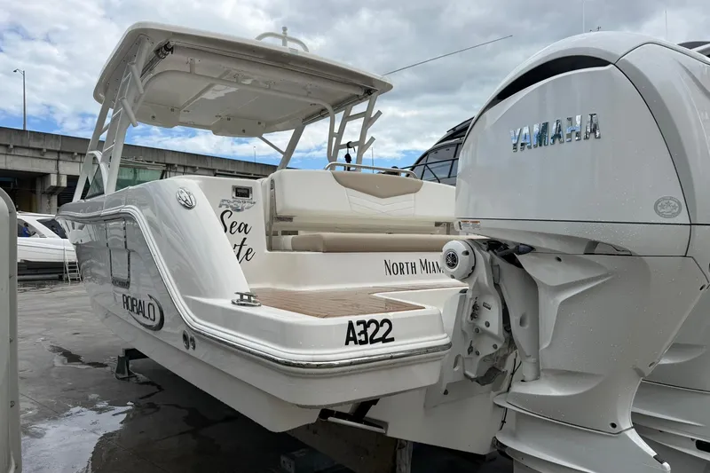 Slide: The Image of 2024 Robalo R317 Dual Console boat with Yamaha engine, docked in North Miami. - 8