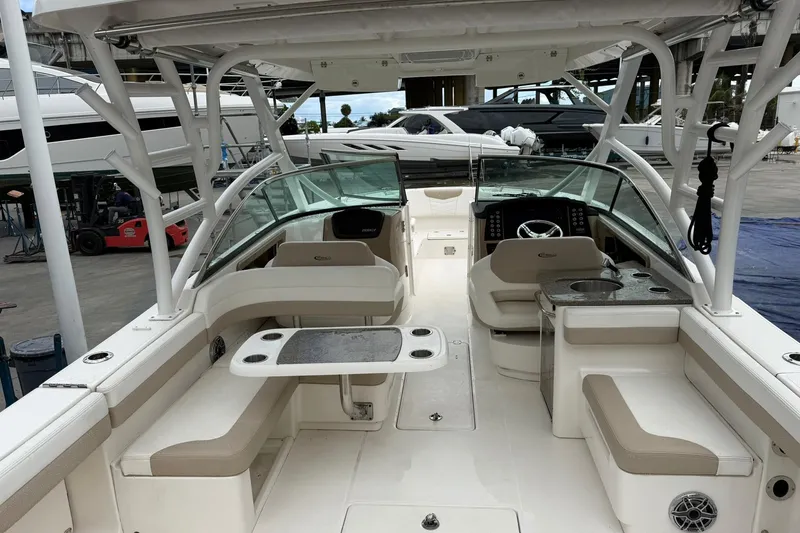 Slide: The Image of 2024 Robalo R317 Dual Console boat interior with seating and helm station. - 9