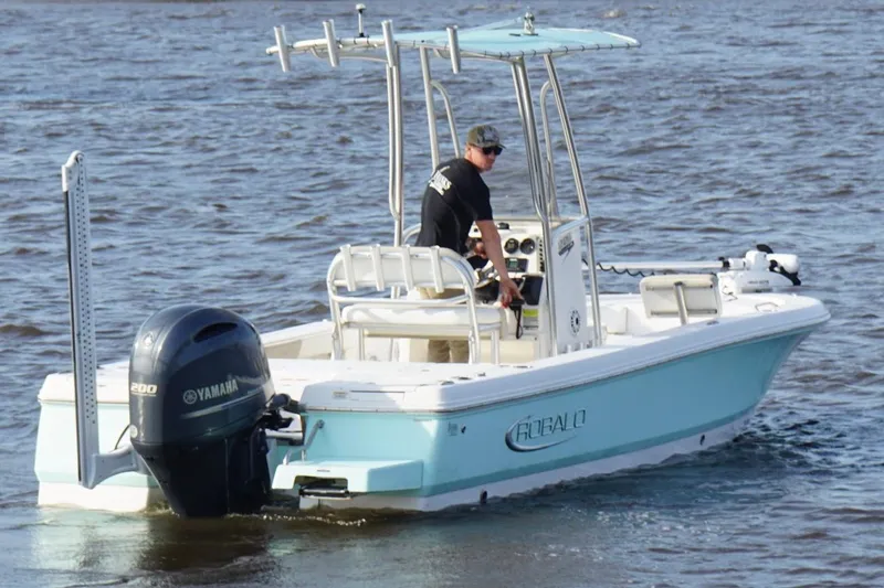 Slide: The Image of 2020 Robalo 226 Cayman boat with Yamaha engine on water. - 9