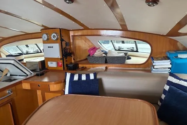 Slide: The Image of Interior of 2004 Soubise Plaisance Freydis 46 yacht with wooden finish and seating area. - 11