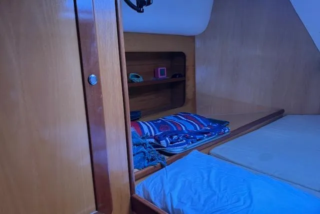 Slide: The Image of Cozy cabin interior of 2004 Soubise Plaisance Freydis 46 sailboat with wooden finish. - 13