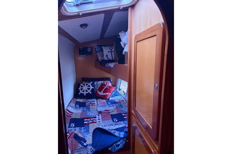 Slide: The Image of Cozy cabin interior of 2004 Soubise Plaisance Freydis 46 with nautical-themed bedding. - 14
