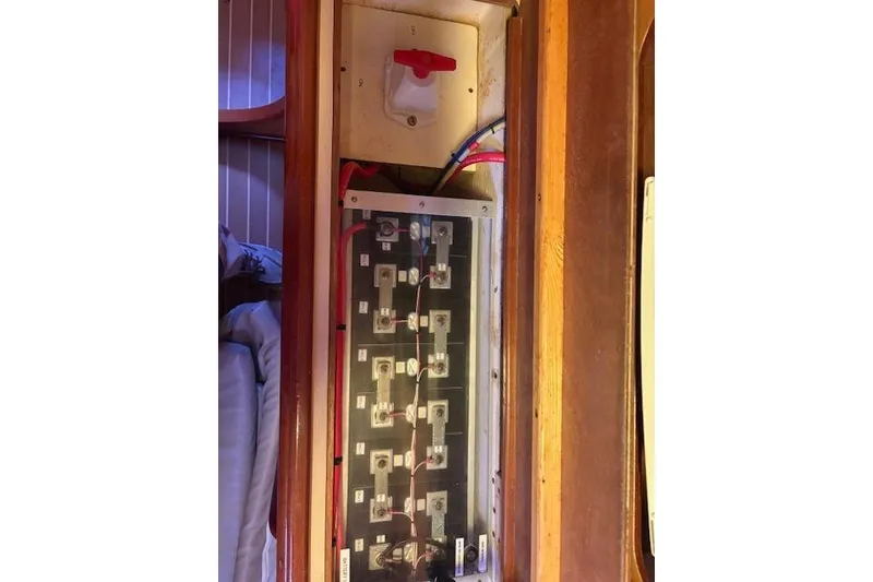 Slide: The Image of Electrical panel inside 2004 Soubise Plaisance Freydis 46 yacht, featuring switches and wiring. - 19