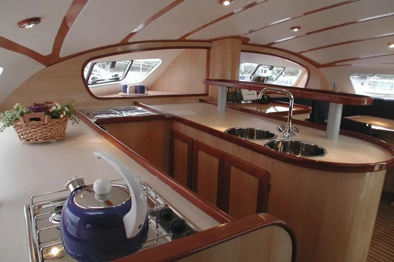 Slide: The Image of Luxurious interior of 2004 Soubise Plaisance Freydis 46 yacht with modern kitchen amenities. - 6