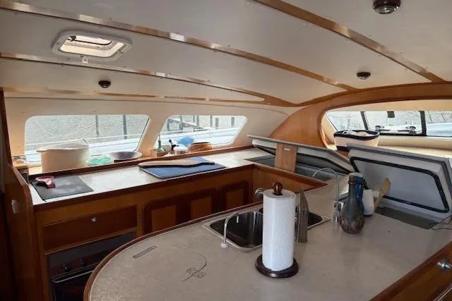 Slide: The Image of Interior of 2004 Soubise Plaisance Freydis 46 catamaran, featuring spacious kitchen area. - 7