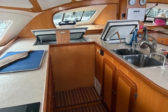Slide: The Image of Interior of 2004 Soubise Plaisance Freydis 46 yacht, featuring a modern kitchen area. - 8