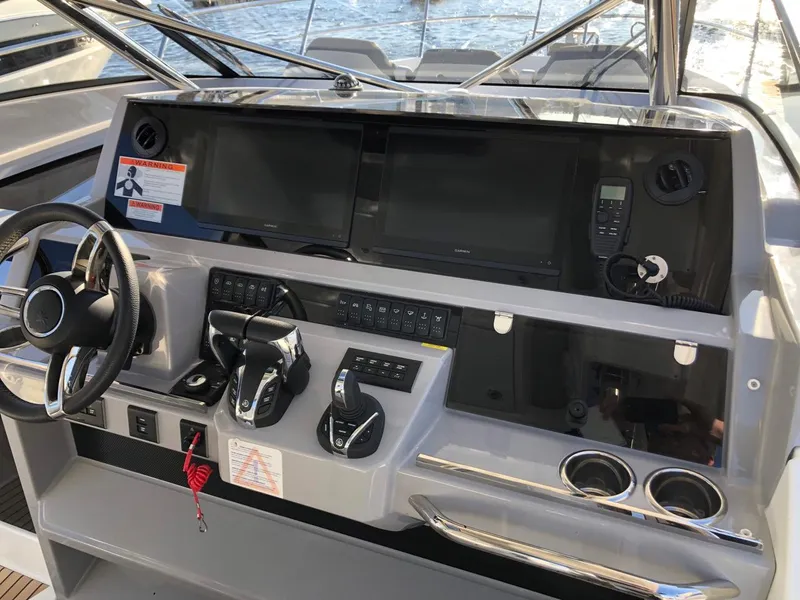 Slide: The Image of Helm of 2024 Jeanneau Leader 12.5 WA with modern controls and navigation displays. - 13