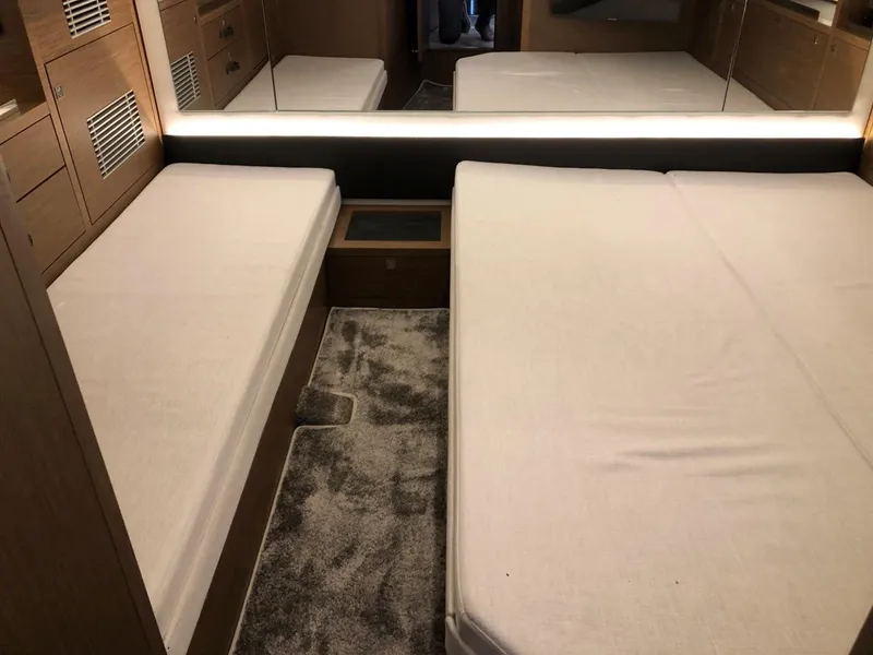 Slide: The Image of 2024 Jeanneau Leader 12.5 WA cabin interior with twin beds and modern design. - 29