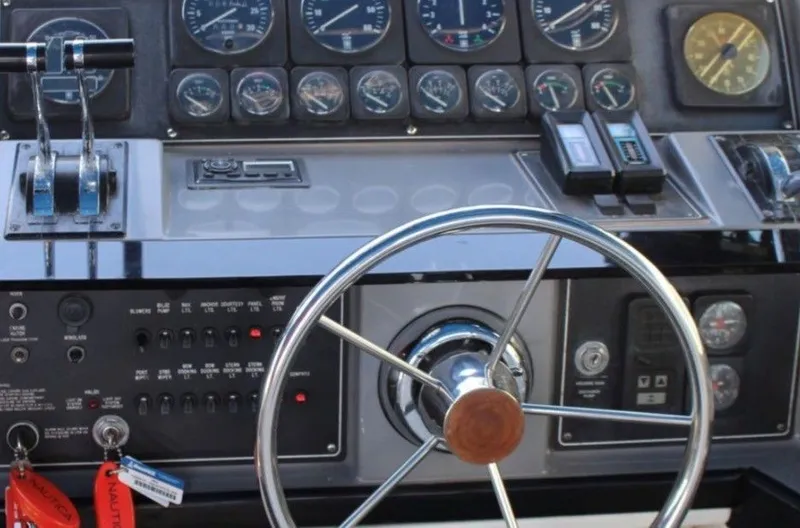 Slide: The Image of Dashboard of a 1988 Formula 35 PC boat with steering wheel and gauges. - 3