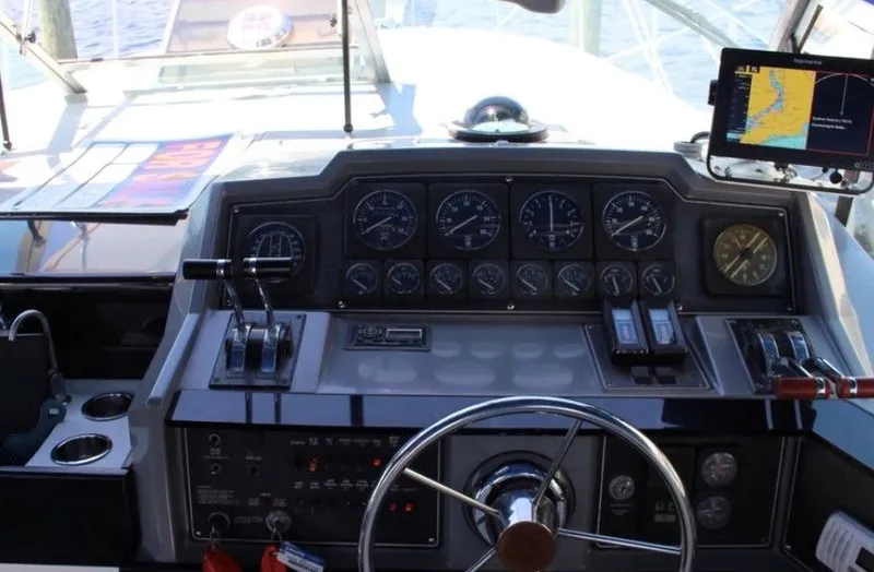 Slide: The Image of Dashboard of a 1988 Formula 35 PC boat with steering wheel and instruments. - 5