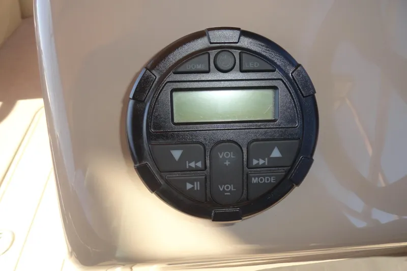 Slide: The Image of 2021 Sun Tracker Party Barge 22 XP3 helm with steering wheel and captain's chair. - 11