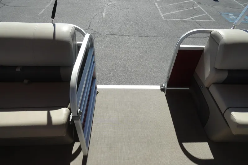 Slide: The Image of 2021 Sun Tracker Party Barge 22 XP3 interior with beige seating and cup holders. - 15