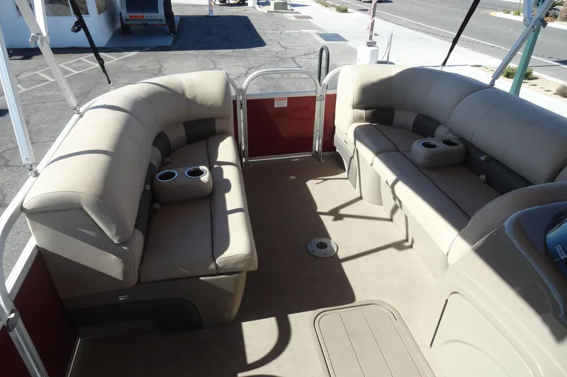 Slide: The Image of 2021 Sun Tracker Party Barge 22 XP3 interior with beige seating and table. - 16