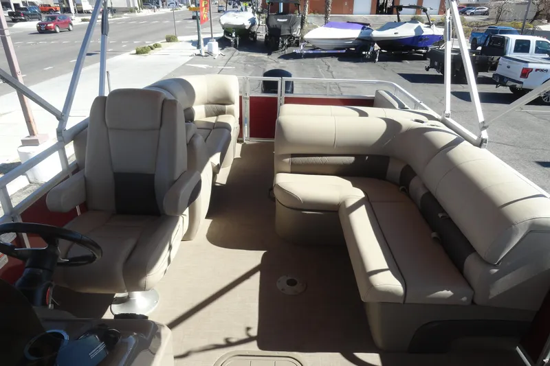 Slide: The Image of 2021 Sun Tracker Party Barge 22 XP3 interior with beige seating and spacious layout. - 19