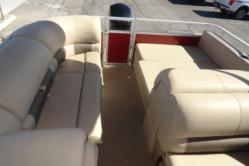 Slide: The Image of 2021 Sun Tracker Party Barge 22 XP3 interior with beige seating and spacious layout. - 20