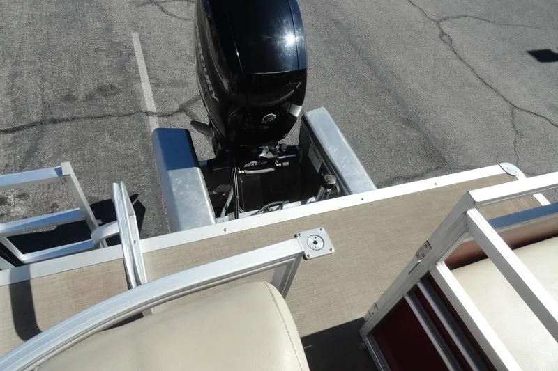 Slide: The Image of 2021 Sun Tracker Party Barge 22 XP3 with outboard motor and boarding ladder. - 22