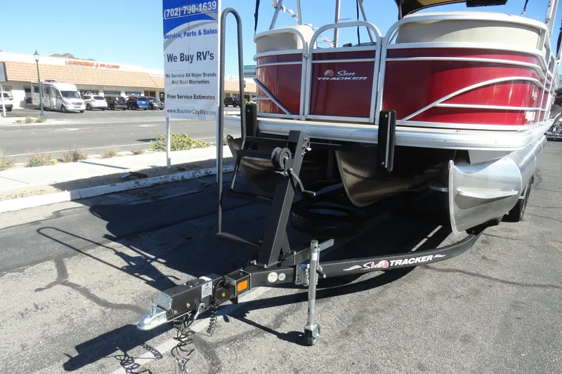 Slide: The Image of 2021 Sun Tracker Party Barge 22 XP3 pontoon boat at RV dealership parking lot. - 24