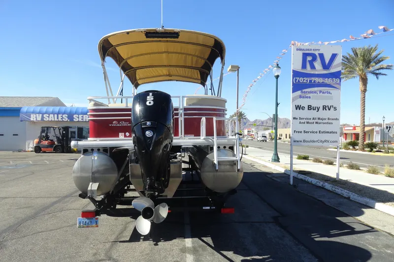 Slide: The Image of 2021 Sun Tracker Party Barge 22 XP3 with Mercury outboard motor in parking lot. - 25
