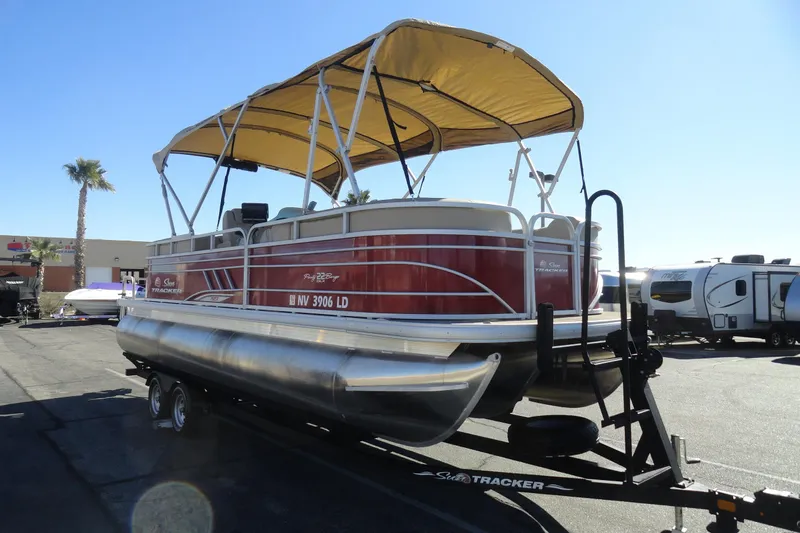 Slide: The Image of 2021 Sun Tracker Party Barge 22 XP3 pontoon boat with canopy and Mercury outboard motor. - 4