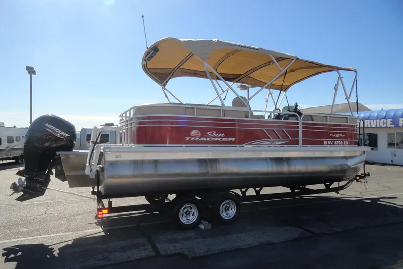 Slide: The Image of 2021 Sun Tracker Party Barge 22 XP3 pontoon boat interior at RV sales lot. - 5