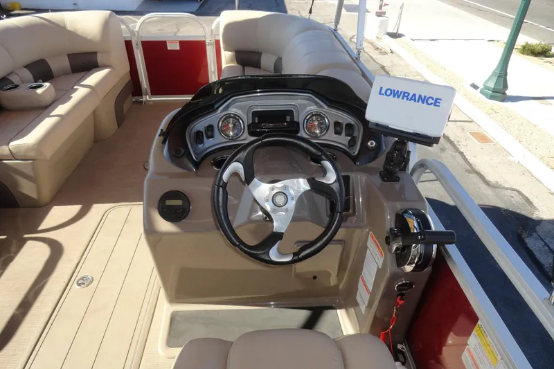 Slide: The Image of 2021 Sun Tracker Party Barge 22 XP3 helm with steering wheel and navigation system. - 8
