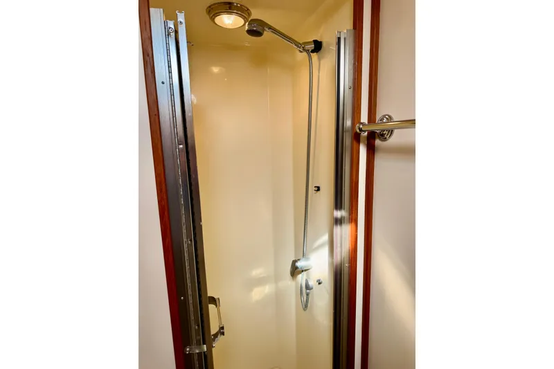 Slide: The Image of Shower area in 2004 Nordic Tug 42 boat, featuring sleek design and modern fixtures. - 17