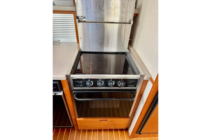 Slide: The Image of Stainless steel stove in 2004 Nordic Tug 42 yacht kitchen. - 30
