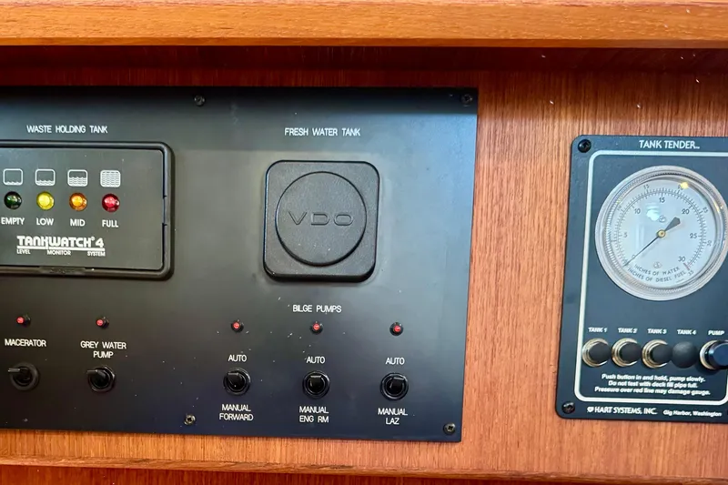 Slide: The Image of Control panel of a 2004 Nordic Tug 42 with tank monitoring systems. - 34