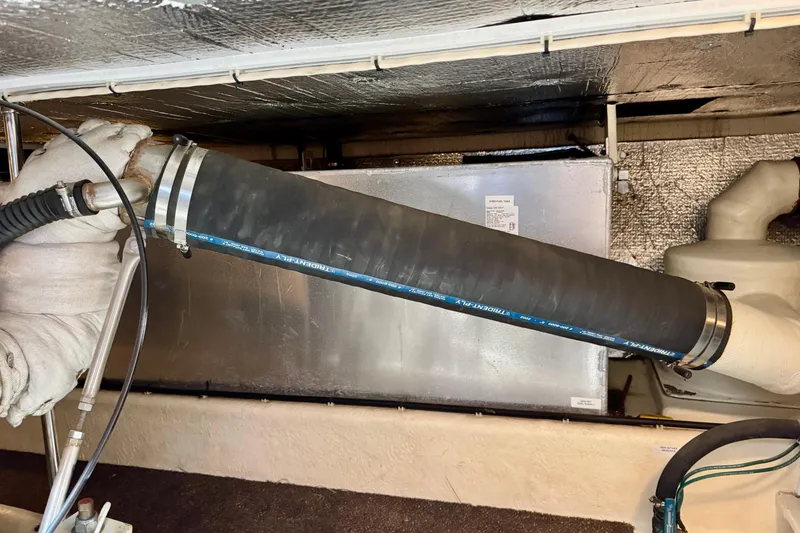 Slide: The Image of Engine room of a 2004 Nordic Tug 42, featuring insulated pipes and components. - 36