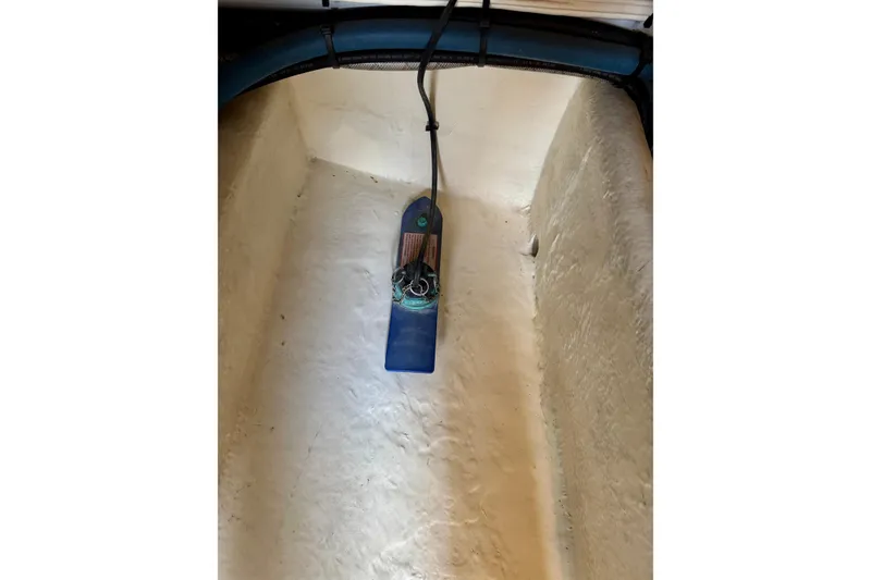 Slide: The Image of Bilge area of a 2004 Nordic Tug 42 boat with a blue pump. - 40