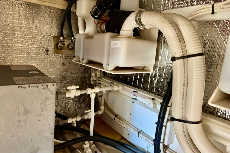 Slide: The Image of Engine room of 2004 Nordic Tug 42 with pipes and insulation. - 41