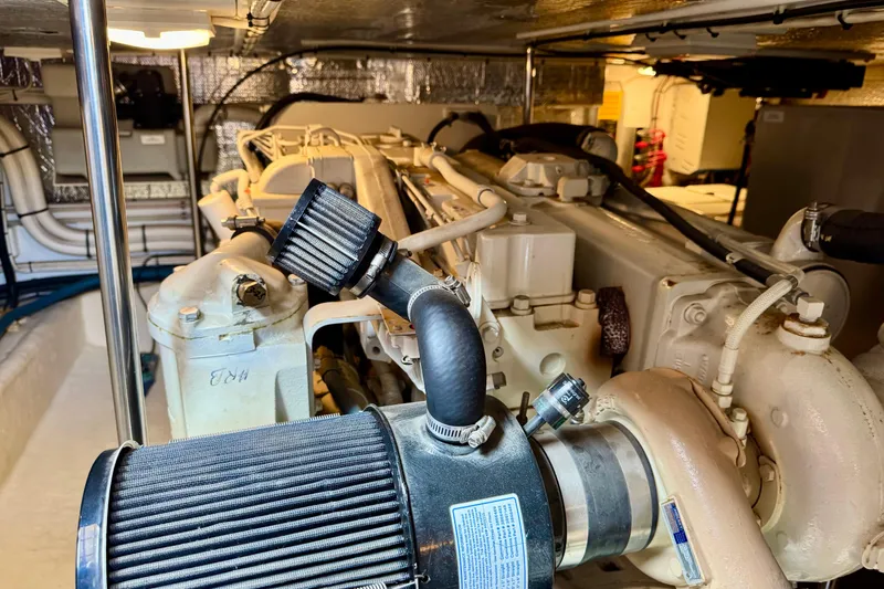 Slide: The Image of Engine room of a 2004 Nordic Tug 42, showcasing detailed mechanical components. - 42
