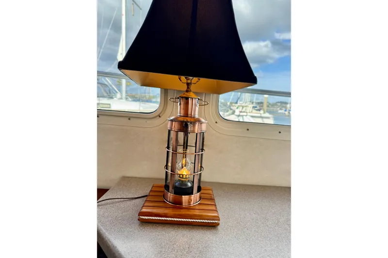Slide: The Image of Nautical-themed lamp on Nordic Tug 42, 2004 model, with marina view through window. - 53