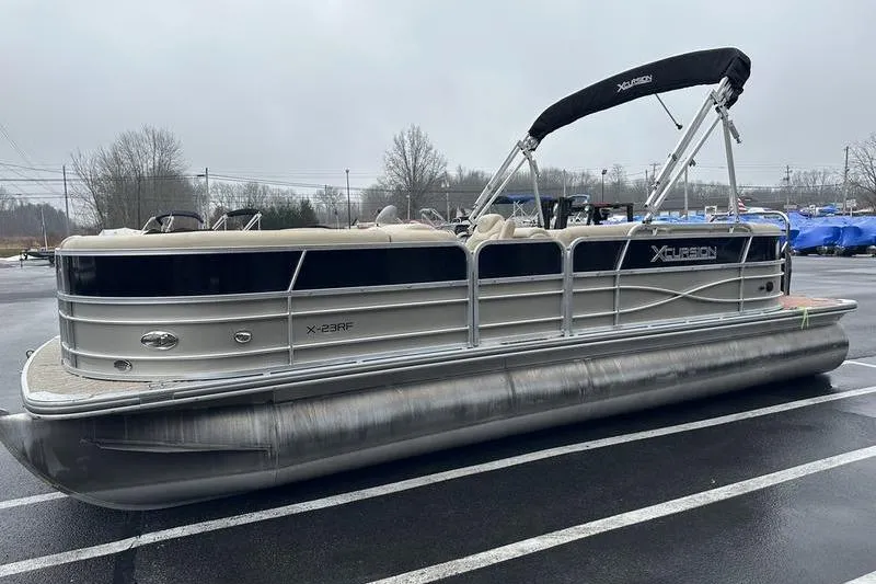 Slide: The Image of 2012 Xcursion X23RF pontoon boat parked on a wet, overcast day. - 10