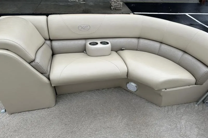 Slide: The Image of Beige seating area on 2012 Xcursion X23RF boat with cup holders. - 16